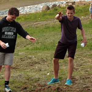Two Camden-Rockport Middle School students help spread a mixture of flower seeds assembled specifically to attract and sustain bees and butterflies at the Camden Snow Bowl on Thursday morning. The community service project was one of 10 end-of-year projects undertaken by the eighth-grade class this year, the day before they attend a promotion ceremony at the school and prepare to enter high school in the fall. (Photo by Holly S. Edwards)