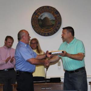 Lt. Dennis Camber, of Rockland Fire and EMS, was recognized by the Rockland city council for 20 years of service. The picture shows Lieutenant Camber receiving a plaque and shaking hands with Rockland Mayor Frank Isganitis. (Photo courtesy Alan Athearn/ Rockland Fire and EMS)