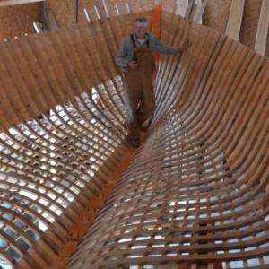 Kenny Dodge, in the hull of his new boat, made from oak cut and milled on his Rockport land. (Photo by Lynda Clancy)