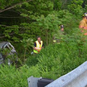 A Jeep veered across Route 1 and rolled several times down an embankment before coming to rest against a stand of trees, Thursday evening, June 11. (Photo by Lynda Clancy)