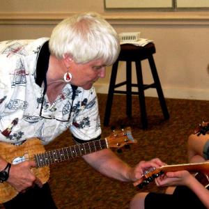 Celia Jones teaches ukulele to children. (Photo courtesy Rockland Public Library)