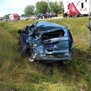 Maine State Trooper Greg Stevens managed to walk away from his wrecked cruiser July 30, after being rear-ended by a tractor trailer truck. (Photo courtesy Maine Office of Public Safety)