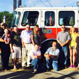 Ben Tolman’s family, from left to right: Nelson, Eric, Monica, Kit, Clay, Nate, Maynard (his father), Krista, Mark, Eric, Bristol, Ashley, Ruth (his mother), and dear friend Greg Rollins. (Photo by Lynda Clancy)