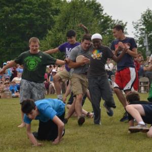 It is all action as the tumble for the cheese wheel begins. (Photo by Lynda Clancy)
