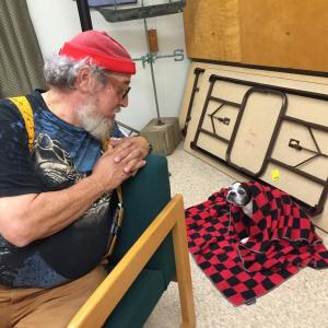 Wiscasset Planning Board member Al Cohen speaks with his Boston terrier Miss Lilly before the start of the board’s Aug. 31 meeting at the municipal building. SUSAN JOHNS/Wiscasset Newspaper Al Cohen, Big Al, Boston terrier, Wiscasset Planning Board