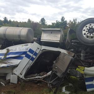 Scott Ware of Gardiner was driving this 2010 Peterbilt 18-wheeler hauling a flatbed trailer loaded with Fisher snowplows and equipment when he drove off the road at a curve and the truck traveled more than 300-feet and rolled onto its roof. (Courtesy Knox County Sheriff’s Office)