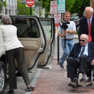 Rusty Brace is wheeled to his car by his attorney Peter DeTroy May 29 in Portland following his appearance in First District Court. (Photo by Lynda Clancy)