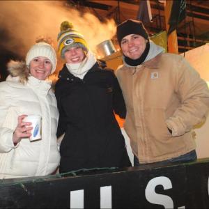 Crew members man the U.S. Coast Guard’s float and keep Main St. free of ice. (Photos by Chris Wolf)