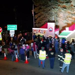 People from Waldoboro area welcoming Santa Claus to their town.