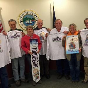 Displaying their 2016 U.S. National Toboggan Championships T-shirts, from left, are Camden Select Board members Don White and Leonard Lookner, co-presenter and Camden Development Director and Winterfest Committee member Karen Brace, Select Board member Jim Heard and chairman John French, co-presenter and Toboggan Championships Committee chairman Holly Edwards and Select Board member Martin Cates. (Photo by Steve Pixley)