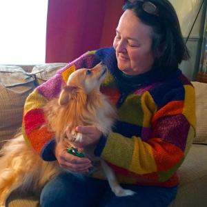 Christine Annis, on a house call, clipping Lily’s nails.