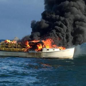 The Miss Lynn succumbs to fire. (Photo courtesy Gerry Cushman)