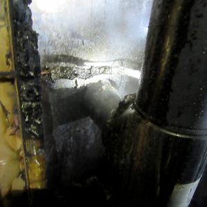 Failure to install this stove pipe with a double jacket or other protection from the wood wall it went through was blamed for igniting a fire Saturday night in Rockport. (Courtesy Rockport Fire Department)