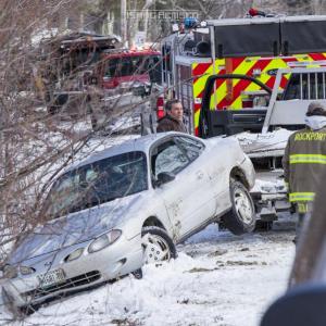 Steve Laite of Camden Exxon removes the vehicle from a ditch on Park Street. (Photo courtesy Isaac Remsen)