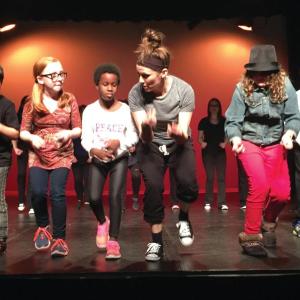 Kea Tesseyman rehearsing with some of her younger performers. (Courtesy Kinectic Energy Alive)