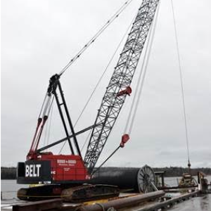 A crane from Reed and Reed is used to lay a new submarine cable to Islesboro. The cable ensures more reliable service to the island community in the future. It also includes a fiber-optic line that will support the community’s efforts to install a broadband network to serve island homes and businesses.
