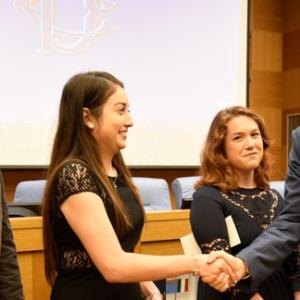 Thomas Oswald Young IV (left) stands with two other foreign exchange students during a ceremony in Italy.