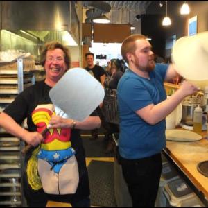 Sarah Vokey and Jake Withee man the hectic pizza line at Rock City Cafe for the Thorndike Creamery Wake. (Photos by Chris Wolf)