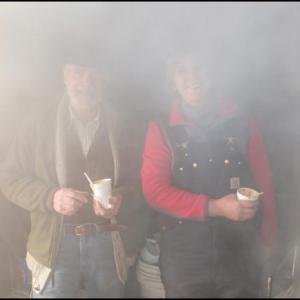 Winston Pendleton and his daughter, Wendy Harvey, are lost in steam as they make maple syrup at the Conway House Museum’s sugarshack Sunday. (Photo by Chris Wolf)