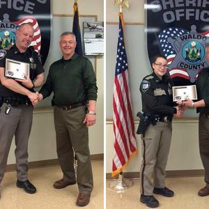Waldo County Sheriff Jeff Trafton with new full-time deputies Andrew Mulligan, left, and Casey McDonald, right, at the agency’s monthly department meeting on April 27.
