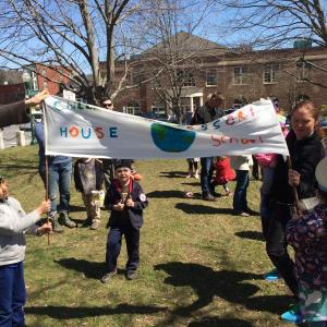 Student Max Turek and Parent Jackie Gelwix held hold a banner. (Photo courtesy Kathryn Dermott)
