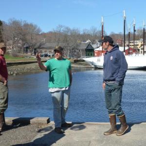 Adam Scott, Camden Harbor Master Steve Pixley and Brad Scott, at the Camden waterfront. (Photo by Lynda Clancy)