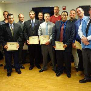Members of the first STRIVE Northern New England graduating class pose with their certificates. (Photo by Erica Thoms)