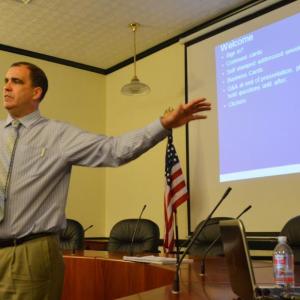 Ernie Martin, Maine Department of Transportation Project Manager, talks to a roomful of Camden, Lincolnville and Rockport residents, officals and state representatives about the upcoming reconstruction of Route One North in Camden. (Photo by Lynda Clancy)