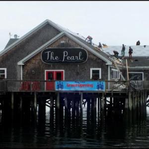 Workers finish the roof getting thePearl ready for its May 17 opening. (Photos by Chris Wolf)
