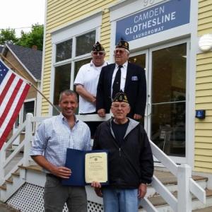 Jamie Weymouth, owner of Camden Clothesline on outer Washington Street, accepts a certificate of recognition from Frank Carr, commander of American Legion Post No. 30 in Camden. Standing in the back from left are Jeff Sukeforth, post adjutant, and Cecil E. Dennison, honor guard member. (Photo by Sarah Shepherd)