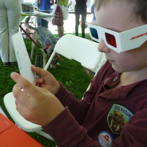A young maker checks out his 3D drawing at CMCA's booth during the 2015 Midcoast Mini Maker Faire in Camden.
