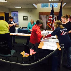 Just soon after 8 p.m., volunteers and Rockport Town Office staff began counting ballots that had been cast June 14, 2016. (Photo by Lynda Clancy)