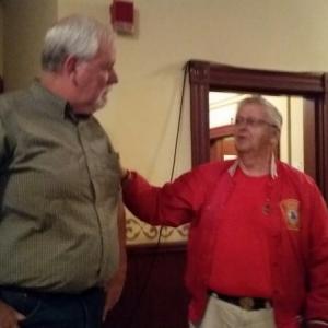 Bob Oxton, former Camden Fire Chief, and his wife Judy, spend time with retired Police Chief Mark Kelley at his retirement party July 7 at the Rockport Opera House.(Photo by Sarah Shepherd)
