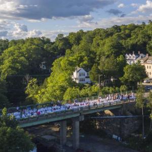 The first-ever Goose River Bridge Dinner was held on the bridge overlooking Rockport Harbor Sunday evening, Aug. 7. By all accounts, it was a blast. (Photo courtesy Isaac Remsen)