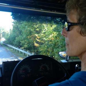 Julie Waters, Five Town CSD and SAD 28 transportation director, behind the wheel of the school bus. (Photo by Lynda Clancy)
