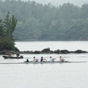 A Megunticook Rowers team passes by exposed rocks in Megunticook Lake on Sept. 19. The lake is about 2 feet lower than it normally is this time of year, due to a lack of rain and leaks at Seabright Dam, which helps control and maintain the river level as it passes through town and empties into the head of Camden Harbor.. (Photo by Holly S. Edwards)