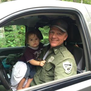 Maine Game Warden Jim Fahey found the toddler sleeping in a tire rut. (Photo courtesy Maine Department of Inland Fisheries and Wildlife)