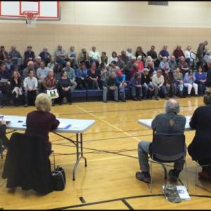 The overflowing crowd cause the warrant vote to be moved from the town office to the school. (Photos by Chris Wolf)
