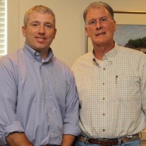 Shawn Doll (L) from BBBS accepts a UMCC grant award from John Burgess (R), UMCC board member.
