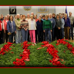 Camden Garden Club members, spouses and friends pose for a photo on Nov. 16, after finishing their annual wreath decorating project at the American Legion Hall on Pearl Street.
