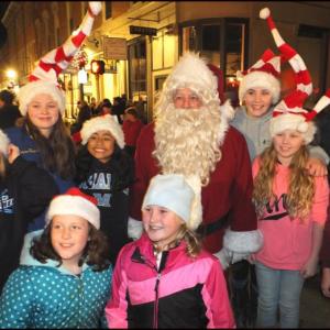 Nothing says the holiday season like Santa Claus, and the Festival of Lights had no shortage of the jolly old guy. He was mobbed by children wherever he went. (Photos by Chris Wolf)