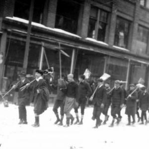 A 1920 photo of a shoveling brigade marching down Main Street. After a winter storm, men from all walks of life would gather together to help clear the nearly impassable roads. (Photo courtesy Rockland Historical Society)