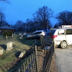 Two vehicles ended up going through the iron fence along Mountain View Cemetery late Wednesday afternoon, after one of the drivers told police he had a medical problem, causing him to cross the centerline and collide with not only one but two oncoming vehicles, the other being a Penobscot Bay YMCA school bus. (Photo by Holly S. Edwards)