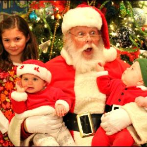 Santa was surprised when a little one pulled his beard to see if it was real. No harm done and I don’t think it got him on the naughty list, but you know he does check it twice. (Photo by Ellie Curtis)
