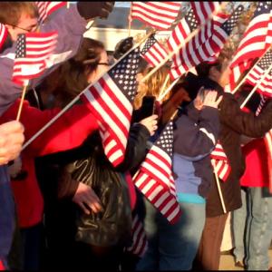 A flag waving crowd greets the Wreaths Across America convoy as they enter Medomak Valley High School. (Photos by Chris Wolf)