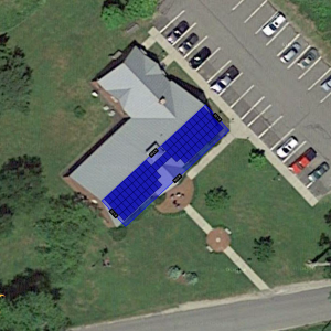 An illustration of the Rockport Town Office, with solar panels installed on the roof.