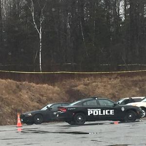Police cordone off the area where the body has been found, behind Dunkin Donuts on Route 1 in Thomaston. (Courtesy Sarah Judkins)