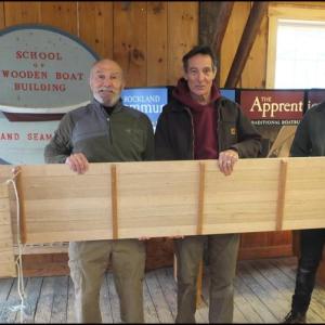 Roger Crossland from Fairfield, Conn.; Kevin Carney, director and lead instructor at the Apprenticeshop; and Joao Bentes apprentice, hold a recently constructed toboggan. (Photos by Chris Wolf)