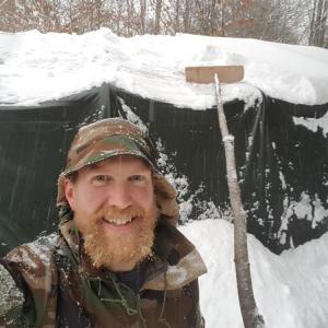 Zachary Fowler at home in Maine with his handmade snow rake. (Photo courtesy Zachary Fowler)