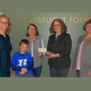 Pictured at the check presentation, from left, are LifeFlight Events Coordinator Shannon Thompson, LifeFlight Patient Carter Duke, Camden Lions Club Membership Chair (and grandmother to Carter Duke) Bette Stone, LifeFlight Director of Communications Melissa Arndt and LifeFlight Development Assistant Christine deLorimier. The donation will help purchase night vision goggles for LifeFlight's third base of operations in Sanford.